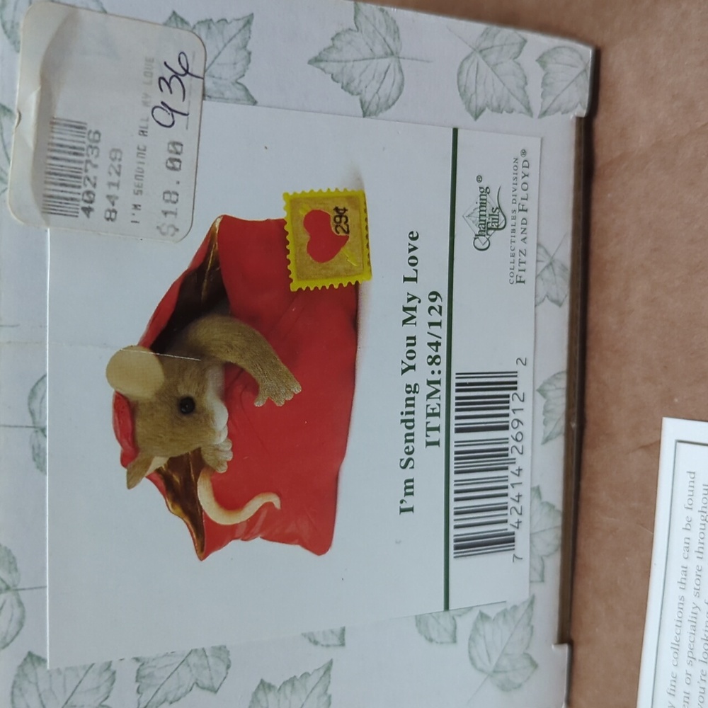 This is a 2004 retired collectible Charming Tails figurine #84/129